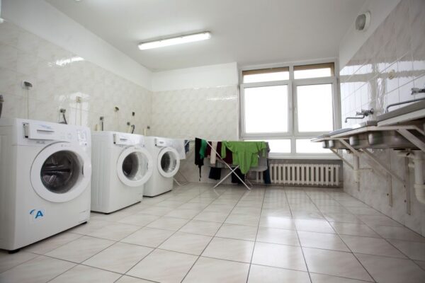 A laundry room featuring a modern washer and dryer, neatly arranged for efficient laundry tasks.